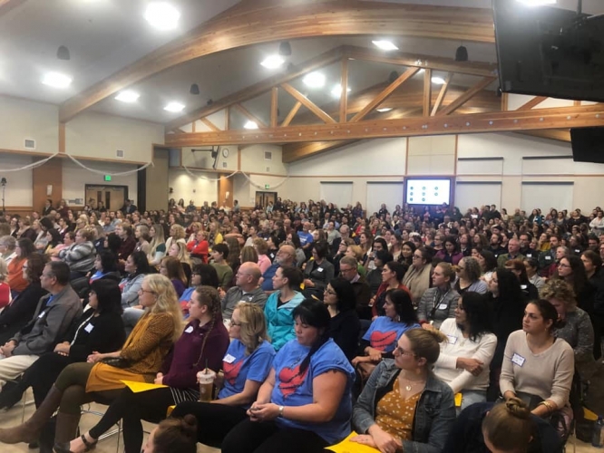 Crowd sitting in auditorium