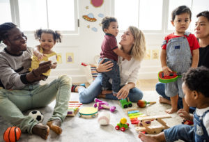 toddler children and parents with musical instruments